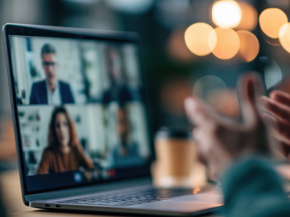Working at a screen, talking with clients